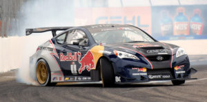 Professional drifter Rhys Millen helped the Genesis Coupe get some attention from the tuning crowd with his Red Bull sponsored drift car