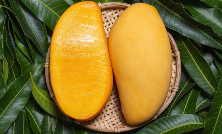Mango sliced in half lengthwise.